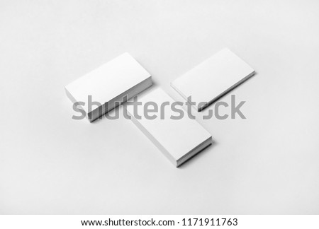 Blank business cards on white paper background. High size mockup.