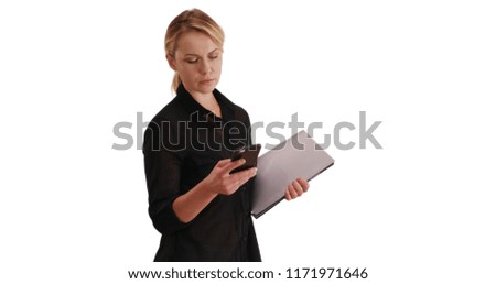 Portrait of Caucasian woman with laptop and texting on phone on white copy space