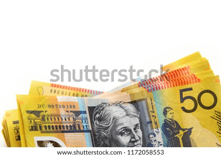 Australian dollar on white background / Australian dollar is also referred to as buck, dough, or the Aussie.
