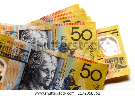 Australian dollar on white background / Australian dollar is also referred to as buck, dough, or the Aussie.