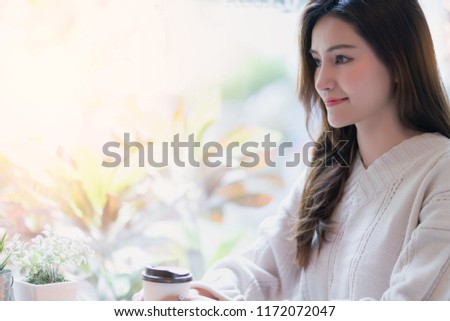 beautiful asian woman enjoy hot drink morninig time near window in cafe shop lifestyle ideas concept