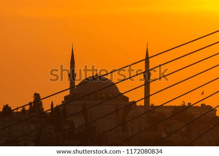 Sunset in Istanbul, Turkey with Mosque View from Galata Bridge in Istanbul.
