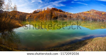 Beautiful autumn landscape with colorful trees and lake