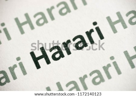 word Harari language printed on white paper macro
