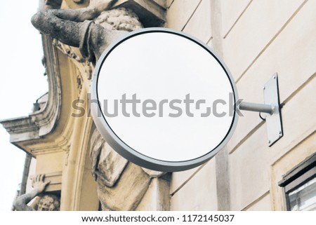 Empty round white stopper on building with classical architecture and daylight. Mock up 