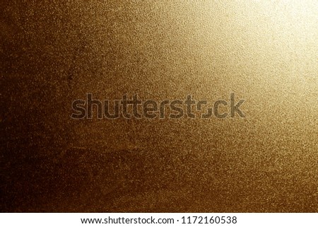 Ground glass texture in orange color with light in corner. abstract background and pattern for designers.