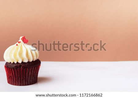 Cute little red heart on white cream cupcake, sweet dessert concept