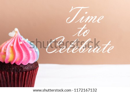 Time to Celebrate, Cute little white heart on rainbow cream cupcake, sweet dessert concept, close up
