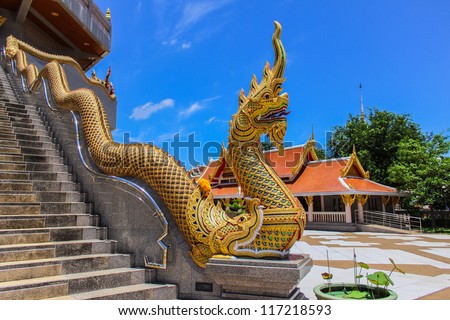 Thai Art, Single Naka statue on staircase balustrade at Thai Buddhist pagoda, Udornthani province, Northeast, Thailand