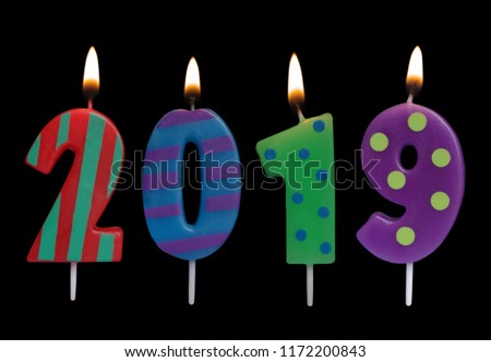 Burning candles on black background, number 2019, new year concept