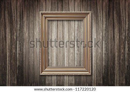 Retro photo frame on wood background