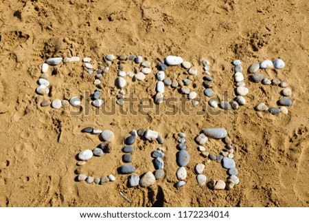 Cyprus 2018 written by stones in the sand on the beach 