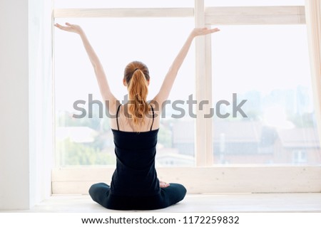 woman raised her hands up yoga asana                             