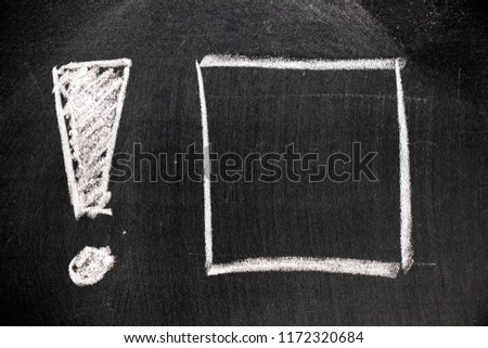 White color chalk hand drawing in exclamation mark with blank square shape on blackboard background