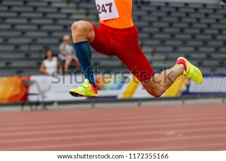 triple jump legs athlete jumper track and field sport Royalty-Free Stock Photo #1172355166