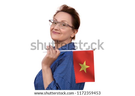 Vietnam flag. Woman holding Vietnam flag. Nice portrait of middle aged lady 40 50 years old with a national flag isolated on white background.