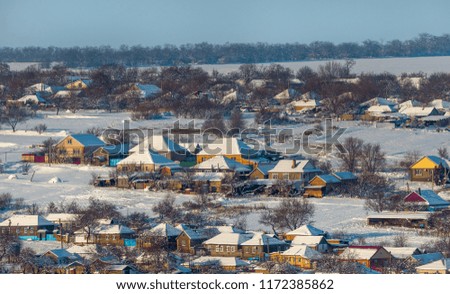 Winter village. Good New Year spirit. Houses in the snow. View from above