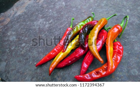 chili pepper on a gray background. vegan, healthy food background.