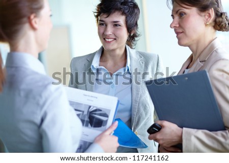 Image of confident businesswomen interacting at meeting