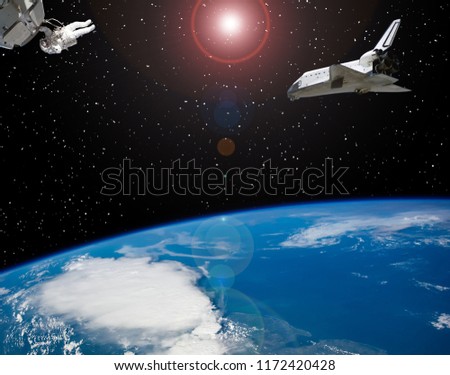Astronaut and spaceships. Lens flare. The elements of this image furnished by NASA.
