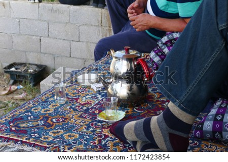 enjoy tea with a teapot in a Turkish house