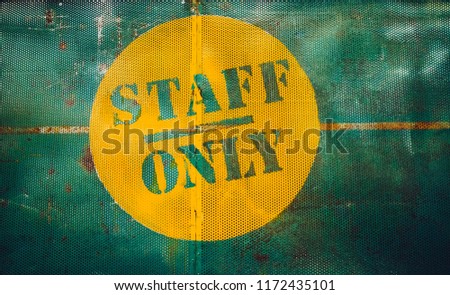 Staff only vintage rusty metal sign on a white background