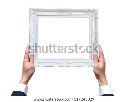 Hand holding wooden frame isolated on white