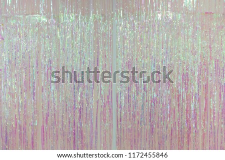 pink foil fringe curtain or plastic rope party decoration. Royalty-Free Stock Photo #1172455846