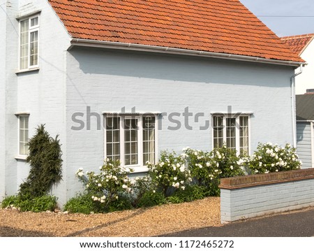 Painted high end cottage and rose garden