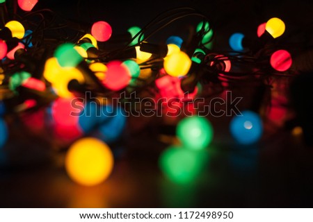 The second garland shines in different colors, the lights of the garland