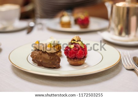 Different Kind of Small Cakes on the Plate, Traditional English Tea Ceremony in Luxury Hotel