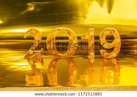 2019 is made in gold color place in golden background is mean the golden year for lucky all year