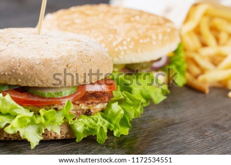 Burger with pork chop and French fries