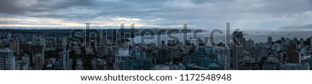 Aerial panoramic view of Downtown City during a stormy summer evening before sunset. Taken in Vancouver, British Columbia, Canada.