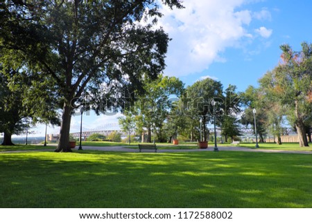 Beautiful trees and green grass field in public park in Memphis, Tennessee, USA