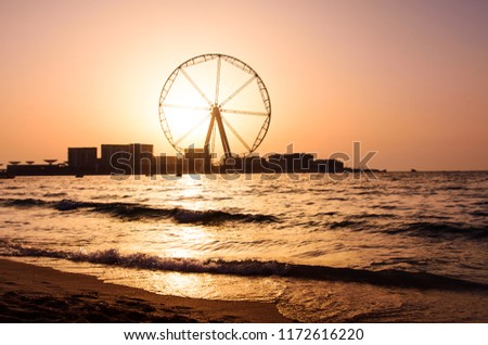 Jumeira Beach Resort beach with Ain Dubai ferris wheel Royalty-Free Stock Photo #1172616220