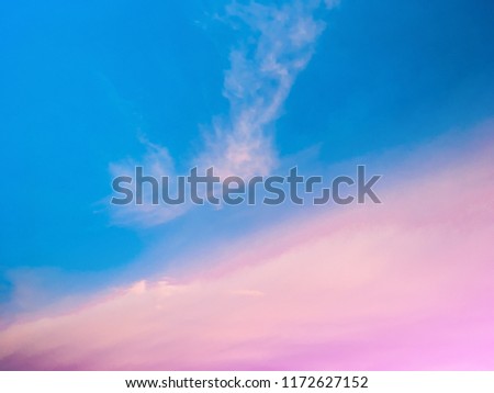 Soft focus to pink clouds on a clear blue sky for Perfect natural texture background.Natural beauty of nature Lovely sweet sky and clound scape photo. Free copy space.