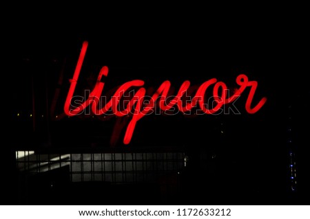 Red glowing neon liquor sign