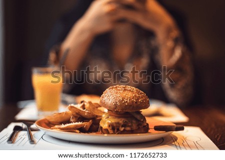 Tasty mini-hamburger with fries is a good meal when you want to chill after a exhausting day.