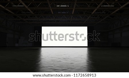 3d rendering of dark empty factory interior or empty warehouse, a glowing white screen in the middle Royalty-Free Stock Photo #1172658913