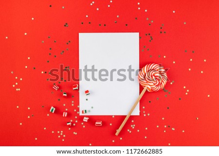 Creative New Year or Christmas greetings letter mockup flat lay top view Xmas holiday celebration envelope on red paper background golden glitter. Template mock up greeting card text design 2019 2020