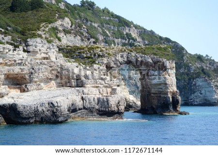 Landscape view of Tripitos Arch in Paxos island, Ionian sea.