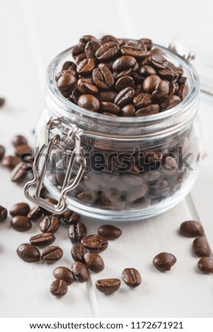 Roasted coffee beans in jar.