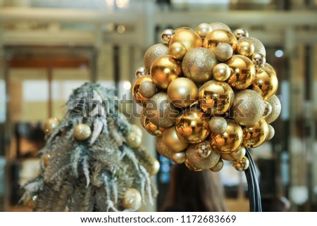 New Year's round golden balls. Christmas balls close up picture. Three golden christmas sparkling balls against . Christmas Ball Decoration