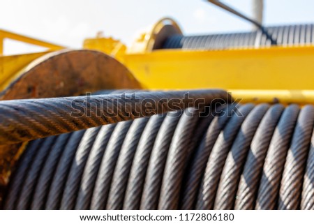 Wire rope sling or cable sling on crane reel drum  or winch roll of crane the lifting machine in heavy industrial Royalty-Free Stock Photo #1172806180