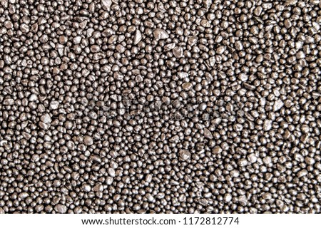 Steel shot for blasting machine. Abstract background of small metal balls. Royalty-Free Stock Photo #1172812774