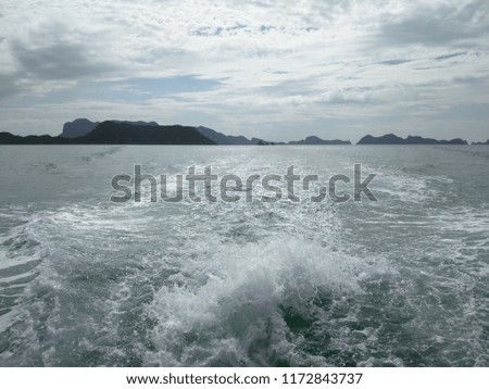 Water surface behind of fast moving cruise ship.