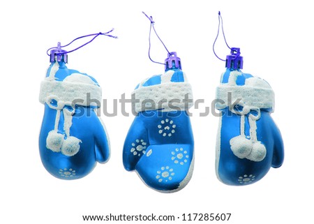 three christmas blue mittens toys isolated on white background
