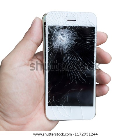 Hands holding a broken smartphone mobile with broken screen isolated on a white background.