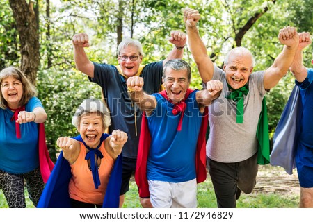 Childlike seniors wearing superhero costumes Royalty-Free Stock Photo #1172946829